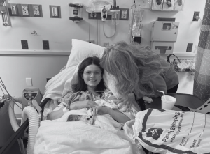 Millicent Maddox (10) with her mother post-surgery on her foot.